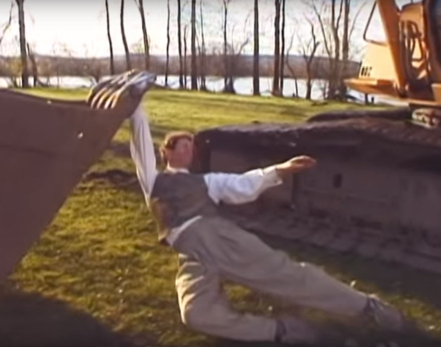 JUST A MAN DANCING W/ AN EXCAVATOR
